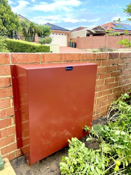 Full home filtration system mounted on a wall outside of a house0002