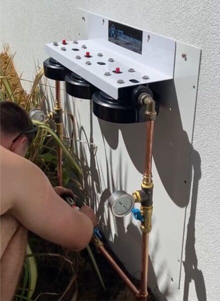 Home Filtration Stystem filters being installed by plumber